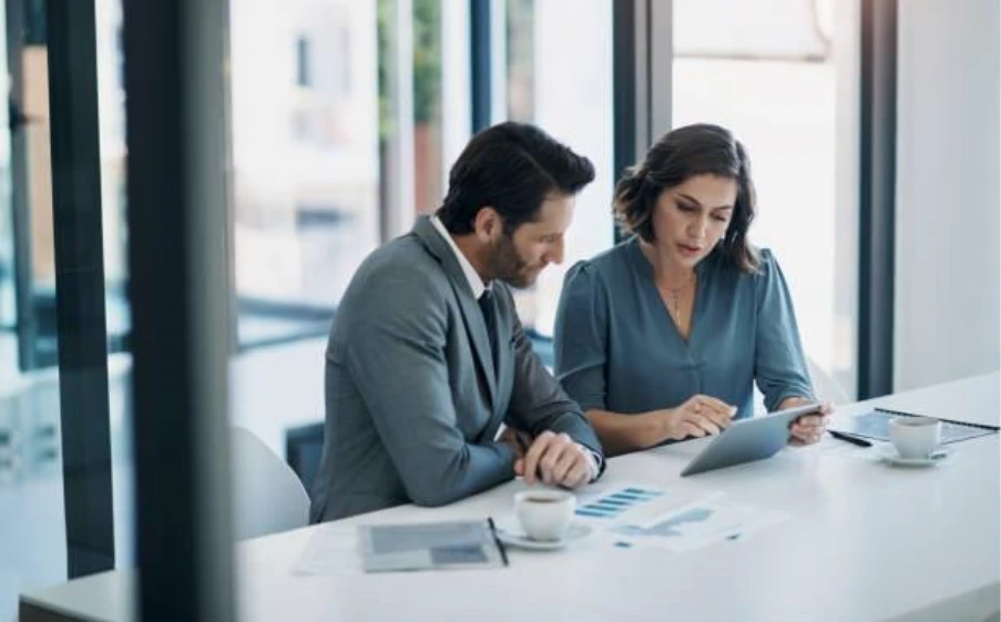 Mortgage Broker UK reviewing documents with clients during bad credit mortgage consultation