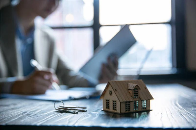 person reviewing mortgage documents after agreement in principle