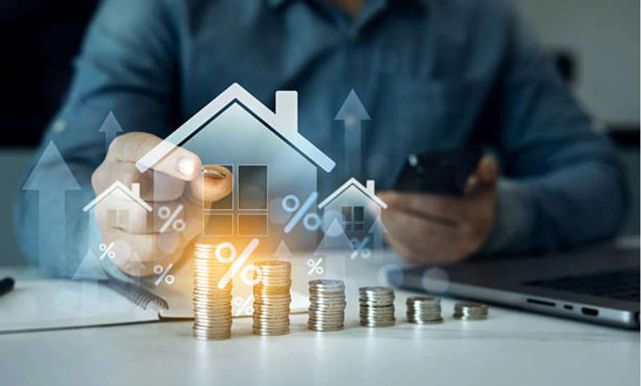stacked coins with house symbols showing impact of rising mortgage rates on mortgage agreement in principle
