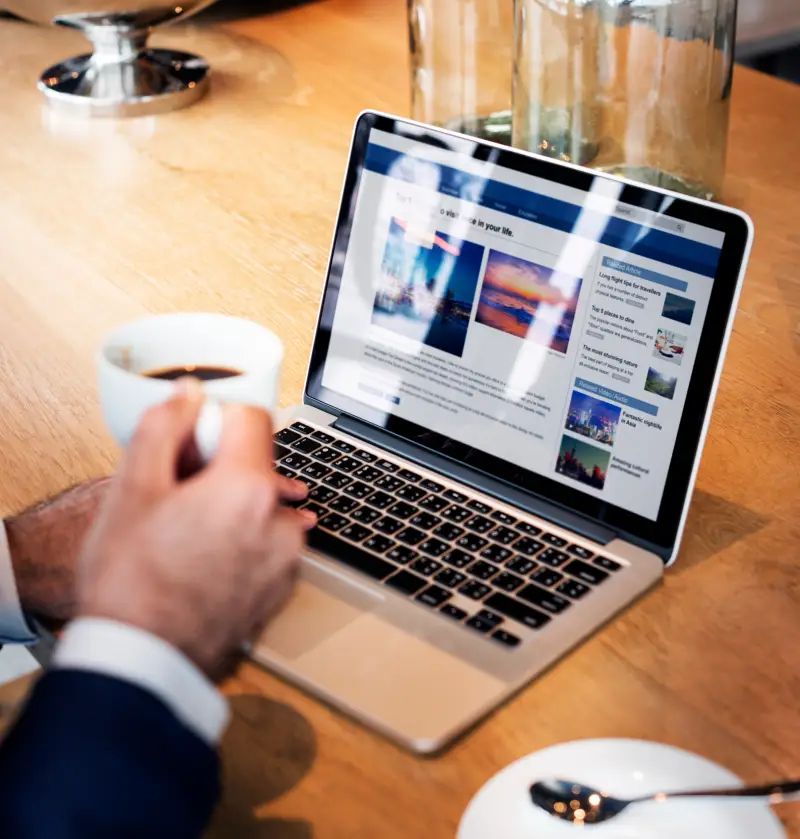 professional reading UK mortgage news and financial updates on laptop